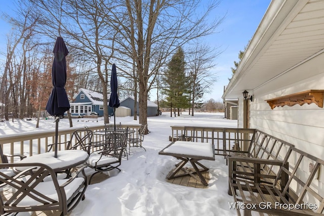 view of snow covered deck