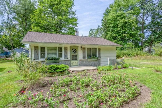 single story home with a front yard and a porch