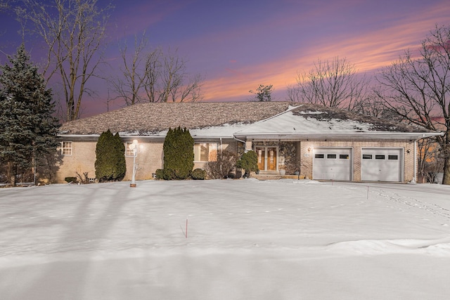 single story home featuring a garage