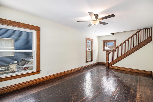 empty room featuring ceiling fan and dark hardwood / wood-style floors