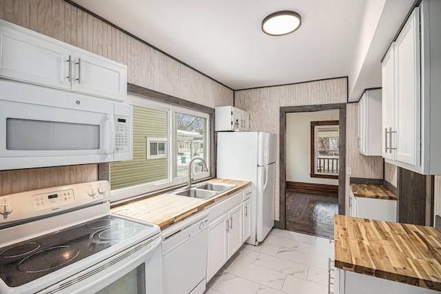 kitchen featuring white cabinetry, sink, white appliances, and wood counters