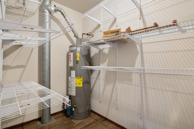 utility room featuring gas water heater