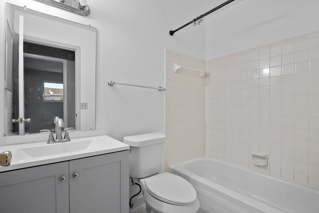 full bathroom featuring vanity, toilet, and tiled shower / bath