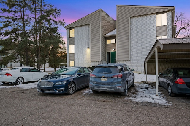 view of front of home with a carport