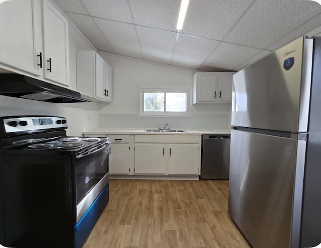 kitchen featuring white cabinetry, stainless steel appliances, sink, light wood-type flooring, and a drop ceiling