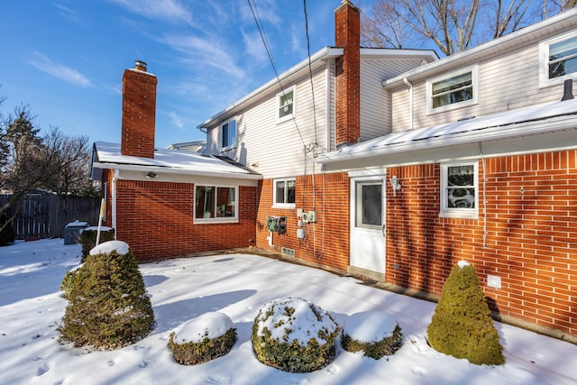 view of snow covered house