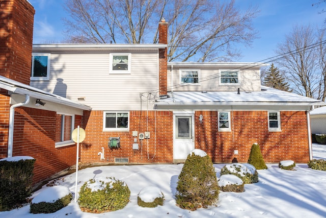 view of snow covered house