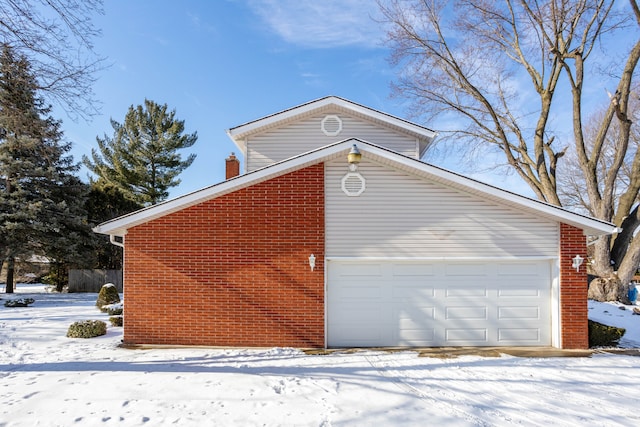 view of snow covered garage