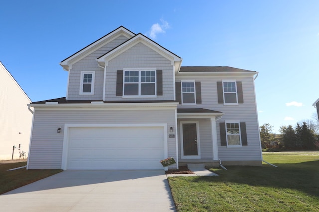 view of front of house featuring a garage and a front yard