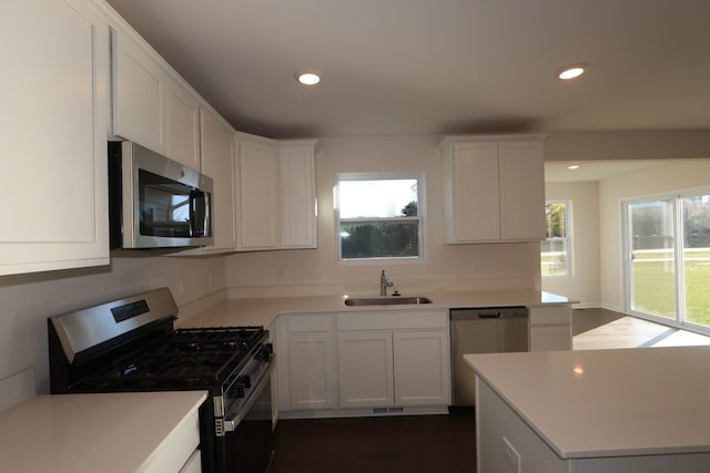 kitchen with white cabinets, sink, and stainless steel appliances