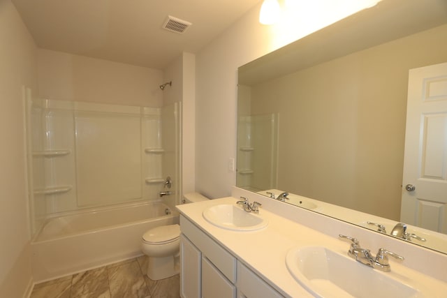 full bathroom with bathtub / shower combination, toilet, and vanity