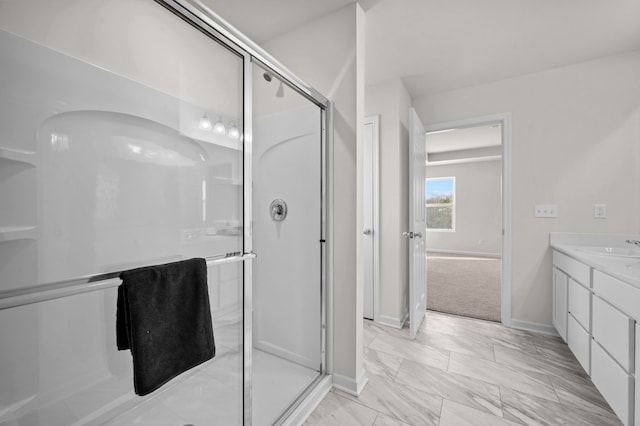 bathroom with vanity and an enclosed shower