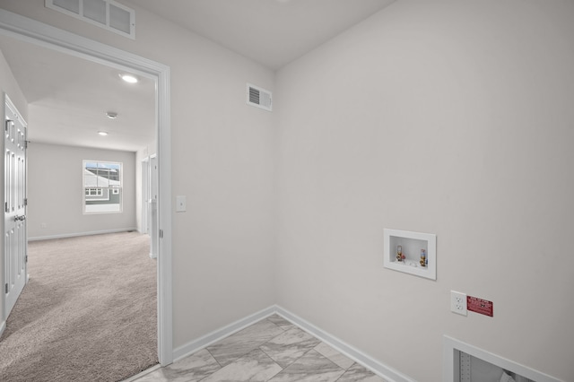 washroom featuring hookup for a washing machine and light colored carpet