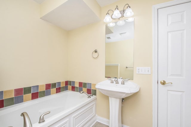 bathroom with a sink and a bath