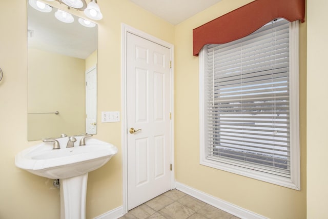 bathroom with baseboards