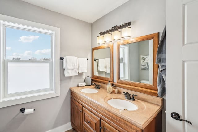 bathroom with toilet and vanity