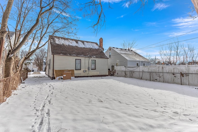 view of snow covered house