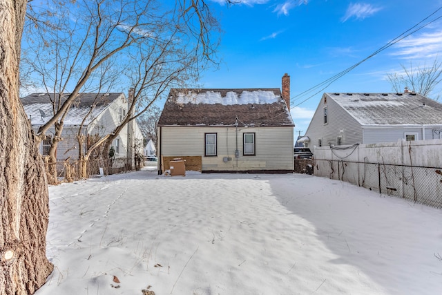 view of snow covered house