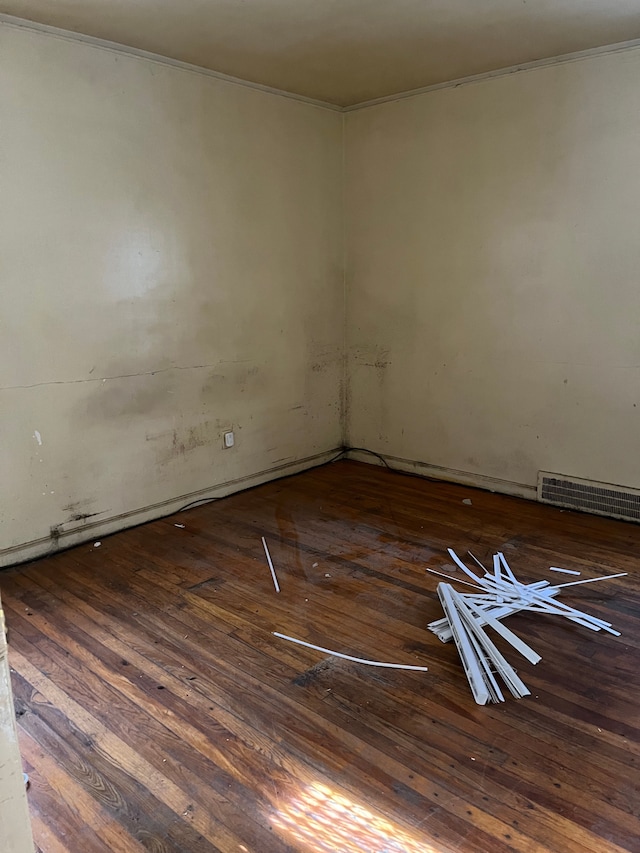 empty room featuring dark hardwood / wood-style flooring