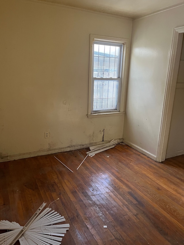 spare room featuring dark hardwood / wood-style floors