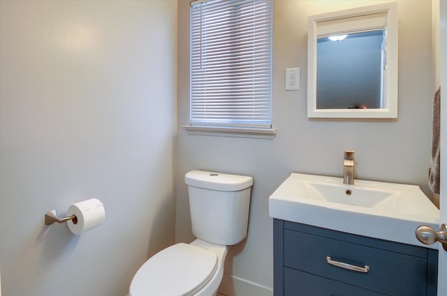 bathroom with toilet and vanity