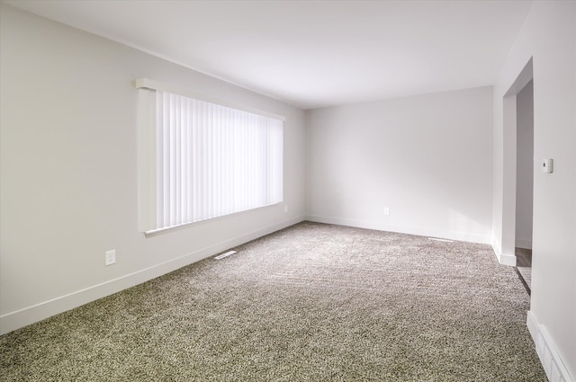 empty room featuring carpet flooring