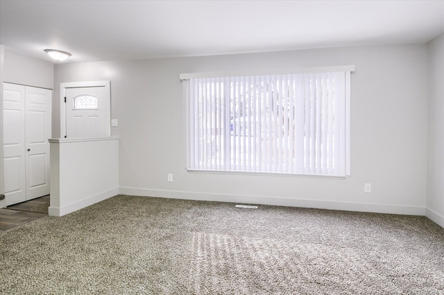 foyer featuring carpet floors