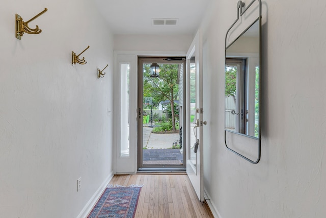 doorway to outside featuring light hardwood / wood-style flooring