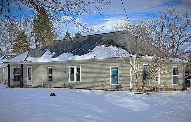 view of snow covered house