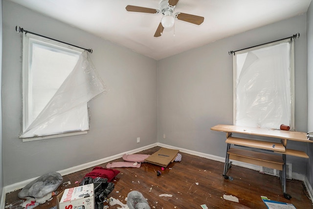 misc room featuring ceiling fan and dark hardwood / wood-style flooring