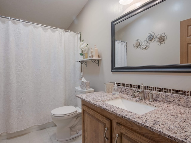 bathroom featuring vanity, toilet, and tile patterned floors