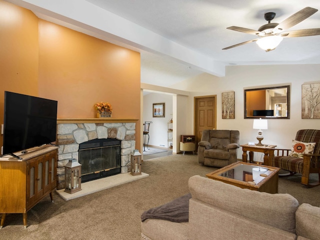 living room with a fireplace, carpet flooring, vaulted ceiling with beams, and ceiling fan