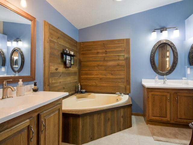 bathroom with wooden walls, tile patterned flooring, vanity, a tub, and lofted ceiling