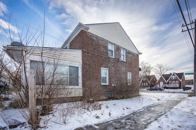 view of snow covered property