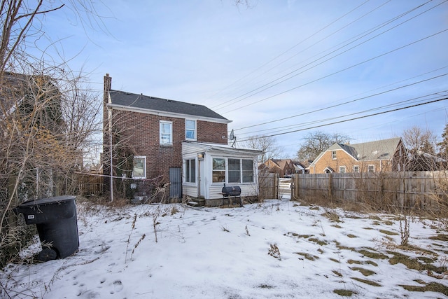 view of snow covered house