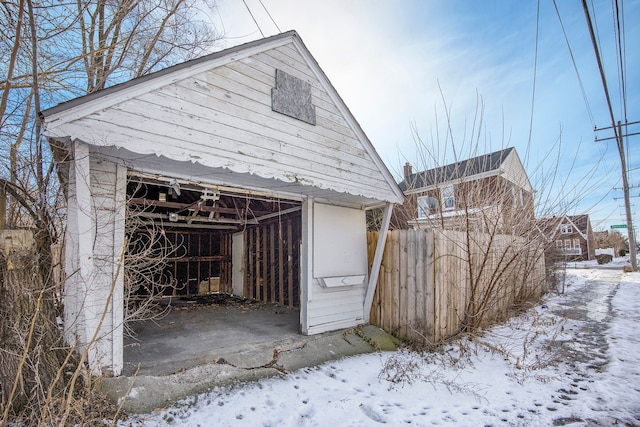 view of snow covered garage