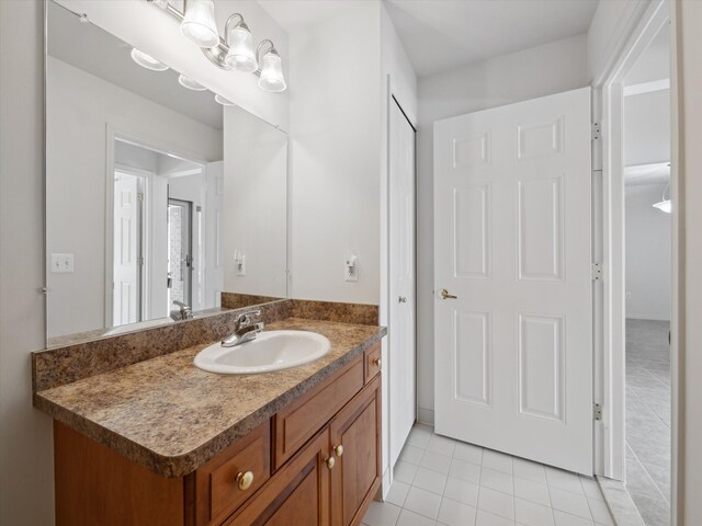 bathroom featuring tile patterned flooring and vanity