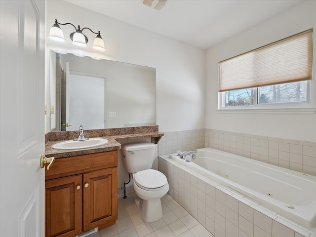 full bathroom featuring a whirlpool tub, toilet, tile patterned flooring, and vanity