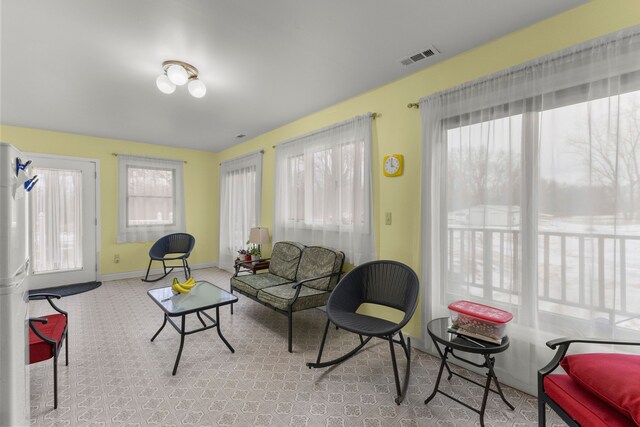 42891 Bemis Rd, Sumpter, MI 48111 - living room featuring a healthy amount of sunlight and light colored carpet
