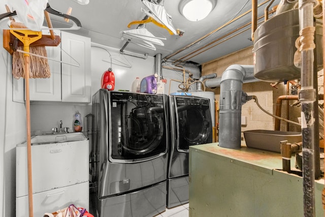42891 Bemis Rd, Sumpter, MI 48111 - washroom featuring separate washer and dryer and cabinets