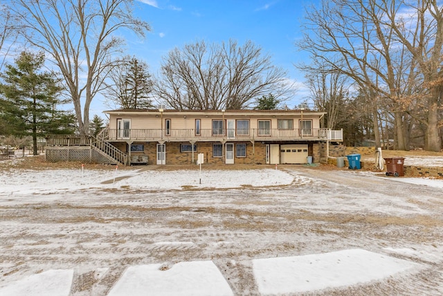42891 Bemis Rd, Sumpter, MI 48111 - view of front of property featuring a garage and a wooden deck