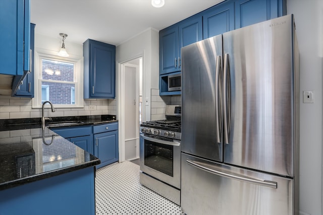 kitchen featuring appliances with stainless steel finishes, dark stone counters, tasteful backsplash, sink, and blue cabinets