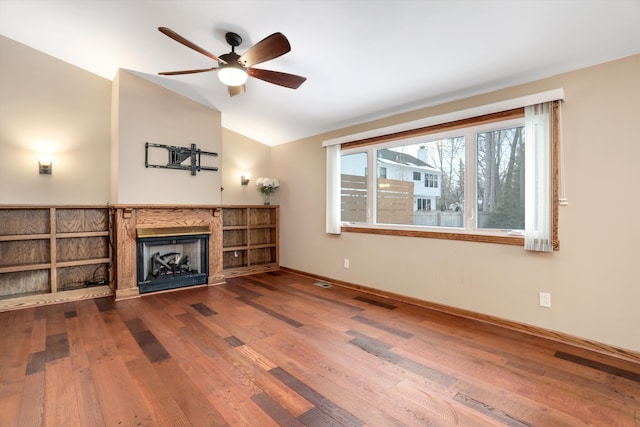 living room with vaulted ceiling, ceiling fan, and hardwood / wood-style flooring