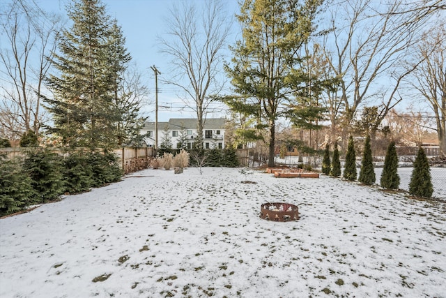 view of yard layered in snow