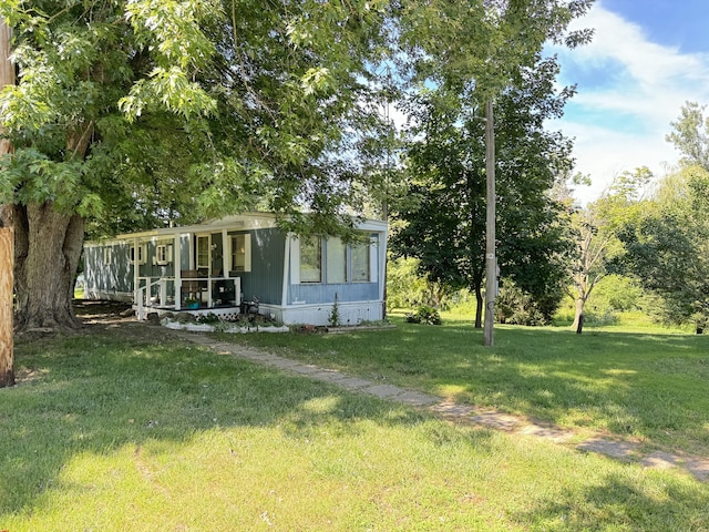 view of yard featuring a sunroom