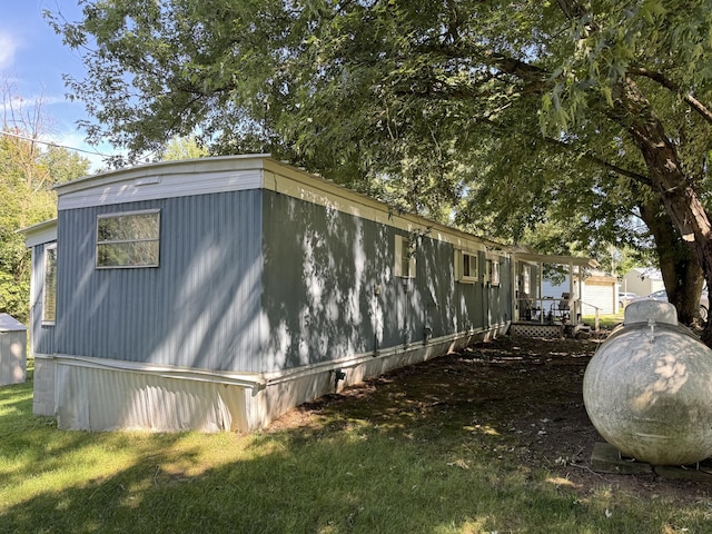 view of side of property featuring a yard