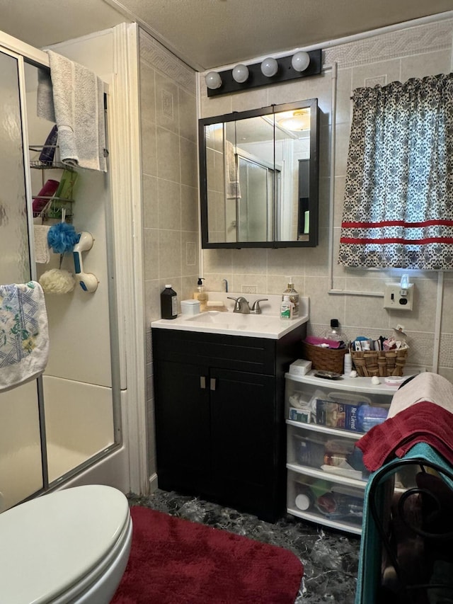 full bathroom with tasteful backsplash, bath / shower combo with glass door, and tile walls