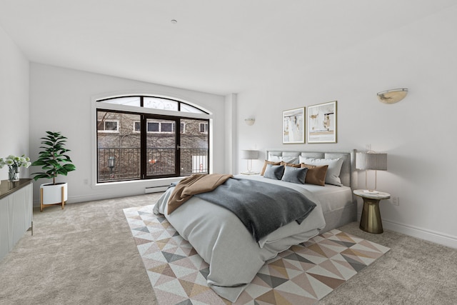 bedroom featuring light colored carpet