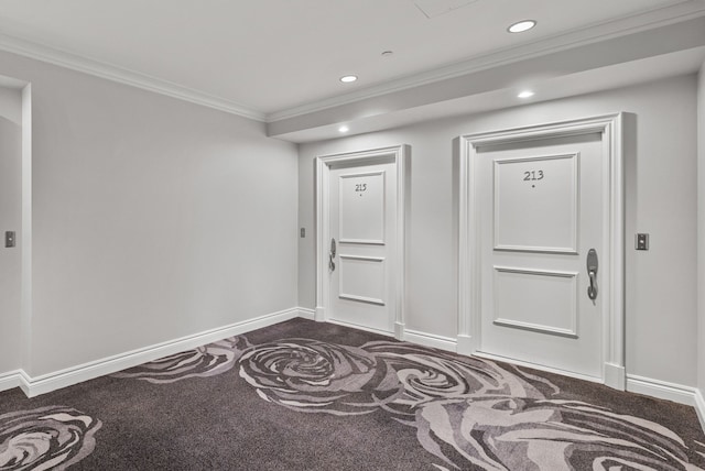 interior space with dark carpet and ornamental molding