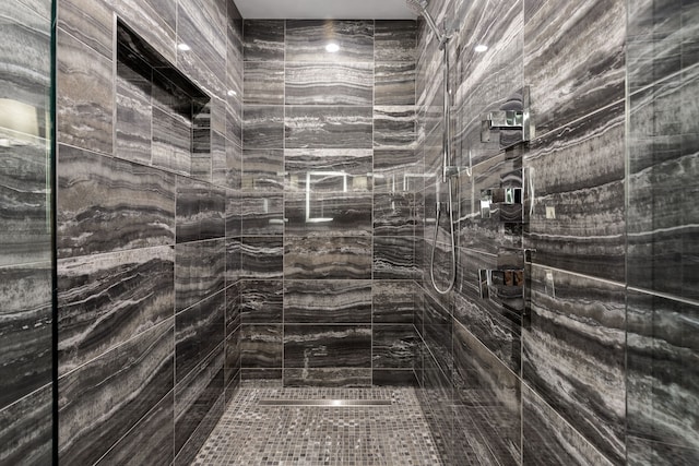 bathroom with tiled shower